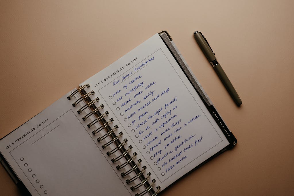 Planner Beside a Pen